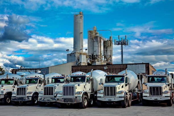 Cement plant and  cement mixer trucks stock photo