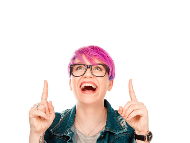 istock woman presenting pointing fingers up to copy space 992416928