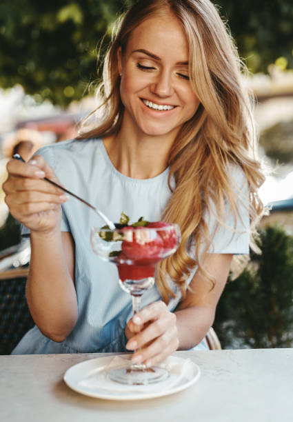 istock Woman in a cafe eating an ice cream 992420956