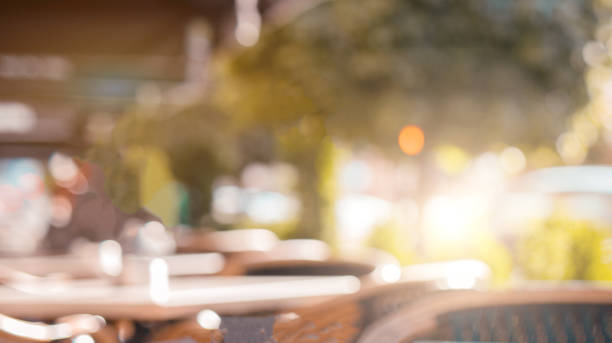 istock Wood table top and blurred restaurant interior background 992420962