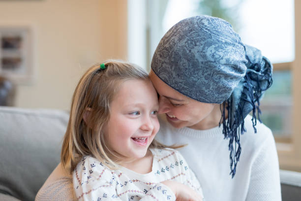 istock Young mom with cancer holds her daughter 992428400