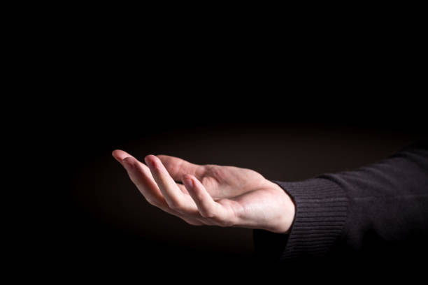 istock Man holding his hand and showing something 992428984