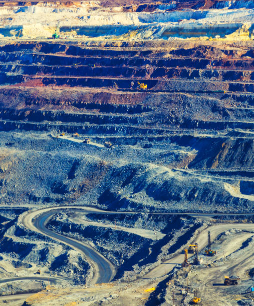 istock multicolored layers of rock in an open pit mining iron ore 992429528