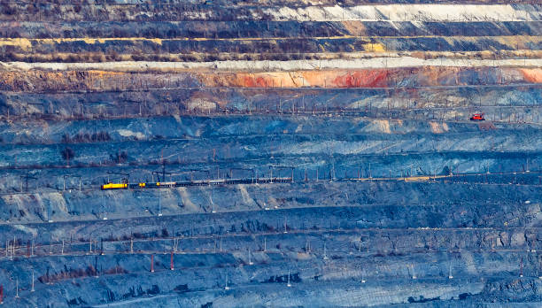 istock The Ground layers in the open pit with a train carrying the breed 992431586