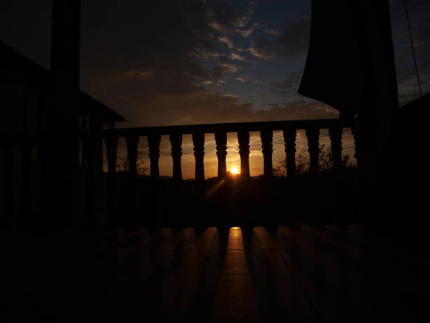 istock Black silhouette of balustrade with sunrise behind 992468156