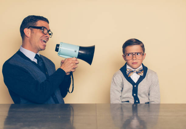 istock Dad Encouraging His Son through a Megaphone 992476194