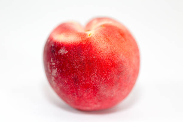 istock Peach isolated on white. Full depth of field 992499872