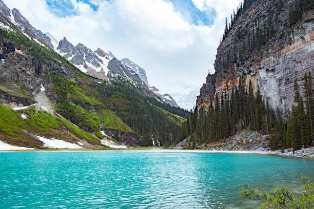 istock Top of lake louise looking into mountains 992500258