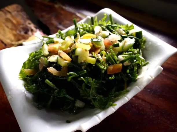 Photo of a plate of Pako Salad or Fiddlehead Fern Salad