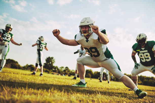 istock Football team doing defensive drills during a practice session 992556422