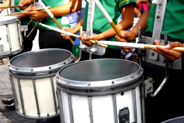 Marching band's drummers playing the drums stock photo