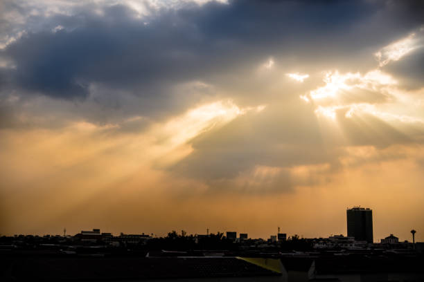 istock orange colorful sunset sky. Beautiful sky. Dramatic rain fall cityscape and cloudscape rain cloud 992568298