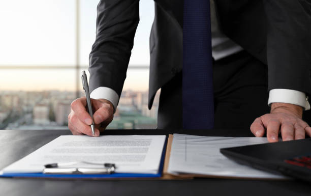 Signing Documents in Office Signing, Signature, Contract, Document, Mortgage Document witness signature stock pictures, royalty-free photos & images