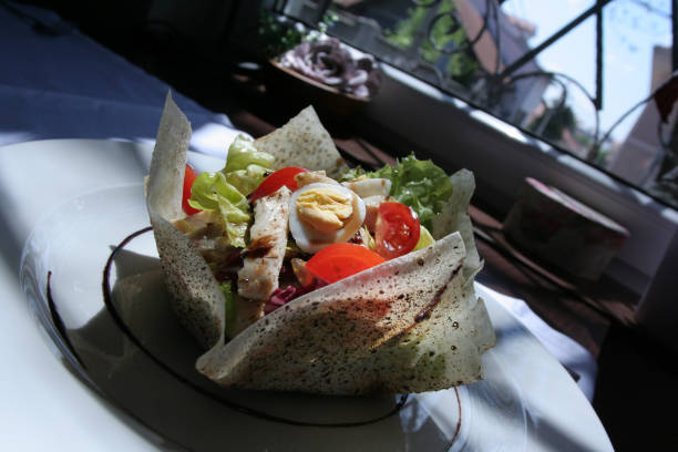 istock Fresh Caesar salad with delicious chicken breast served in restaurant 992619688