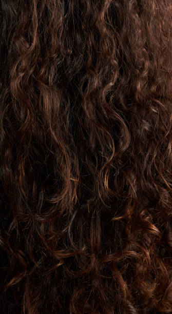 istock Pattern of brown woman hair 992623980