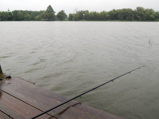 Wooden floor and beautiful lake on the background