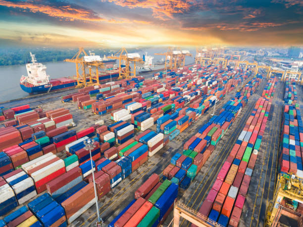 istock Logistics and transportation of Container Cargo ship and Cargo working crane bridge in shipyard 992658268