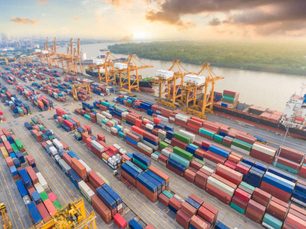 istock Logistics and transportation of Container Cargo ship and Cargo working crane bridge in shipyard 992659166