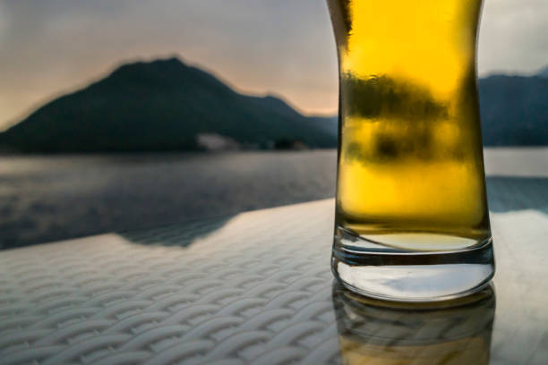 istock a glass of beer on the seashore 992668372