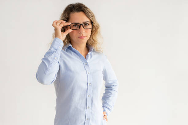 istock Serious confident businesswoman adjusting glasses 992689378