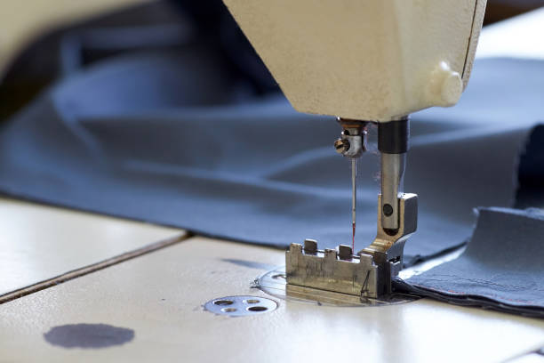 istock Industrial sewing machine sews a ratchet strap. 992705670
