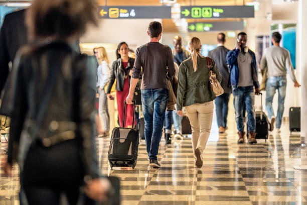 istock Business people walking at airport 992709932