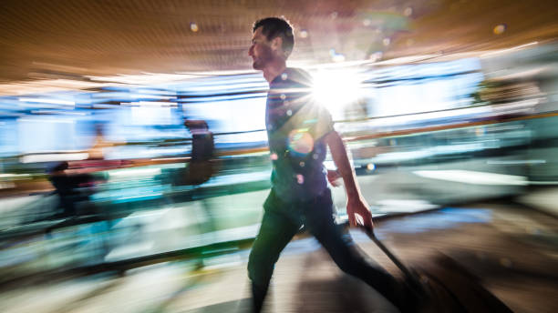 istock Businessman walking in airport 992710010
