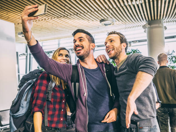 istock Business people in departure lounge 992710012