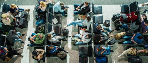 business people in departure lounge - high angle view people people in a row directly above imagens e fotografias de stock