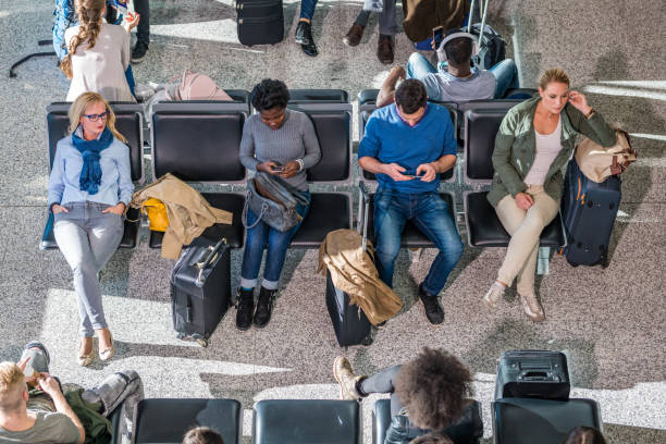 istock Business people in departure lounge 992710704