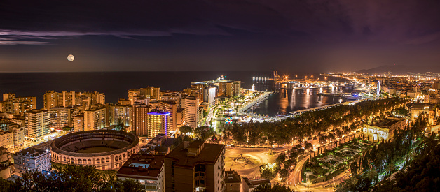 Night view of Malaga city and port from Gibralfaro lookout.