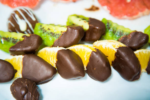 Healthy fruits with chocolate. Close up.