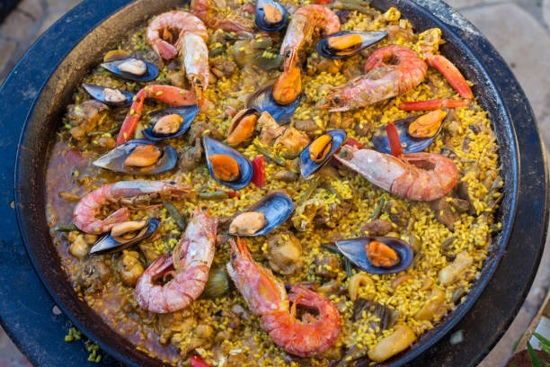 istock Traditional Spanish paella with seafood and chicken in a pan 992715920