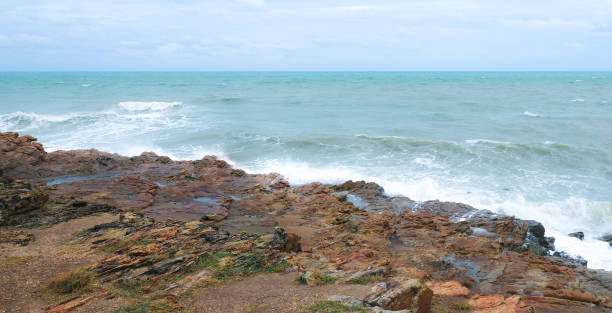 istock Ocean wave background breaking sea water rocky nature. 992719066