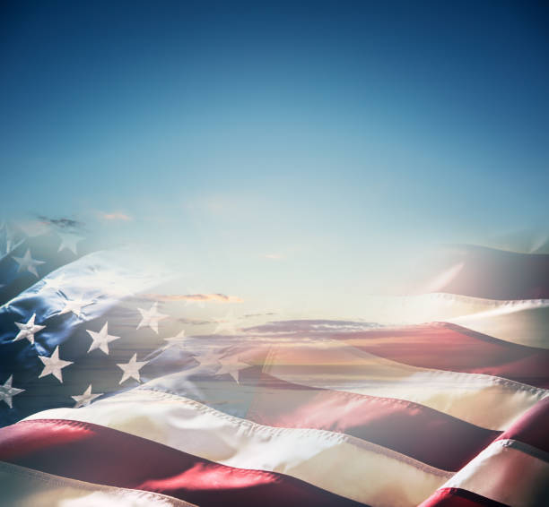 American flag over a beautiful sunset or sunrise.