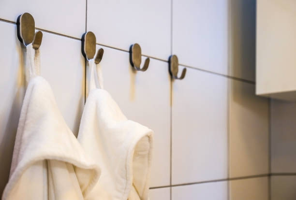 istock Close - up of white Terry bathrobes on bathroom background 992730782