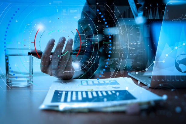 istock business man hand working on laptop computer with digital layer business strategy and social media diagram on wooden desk 992731124