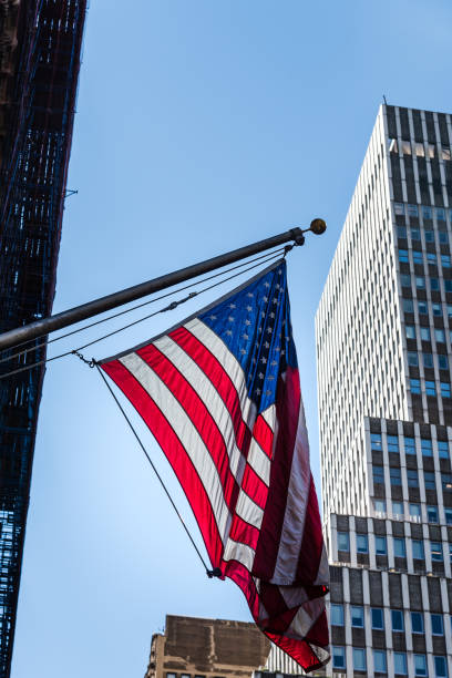istock American flag waving against modern office building 992734880