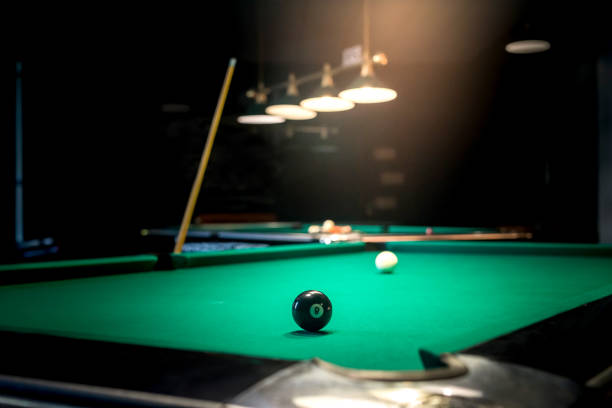 istock Billiard table with black ball number eight 992734968