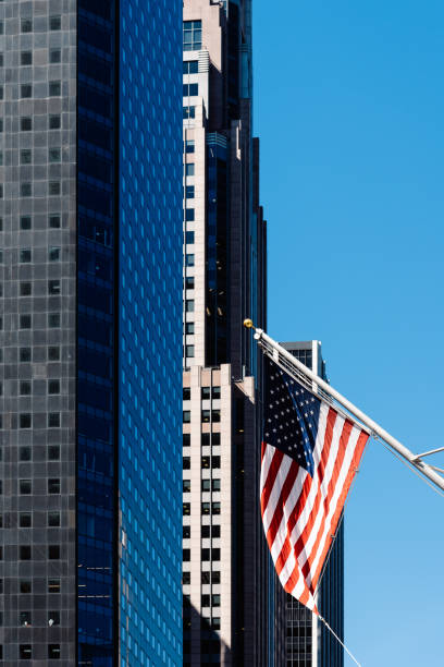 istock American flag waving against modern office building 992735030