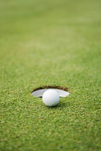 istock Close up of golf ball on green 992739178