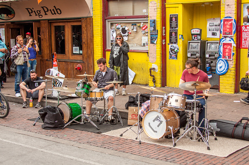 Austin, Texas/United States - March 14, 2014: During the SXSW festival musicians create an impromptu jam session on Sixth St.