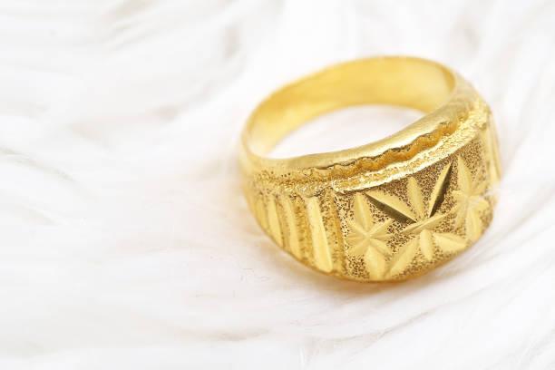 istock Beautiful gold ring on white background 992743822