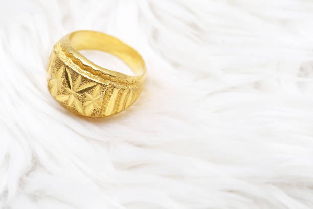 istock Beautiful gold ring on white background 992743920