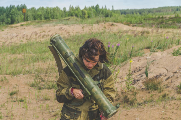 istock girl in uniform with a Bazooka 992754732