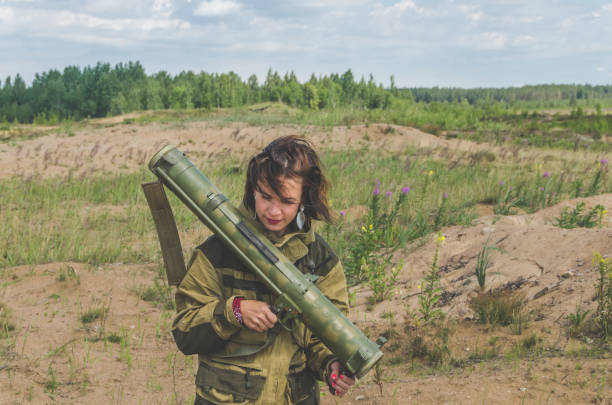 istock girl in uniform with a Bazooka 992754772