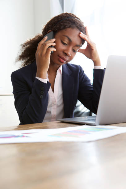 istock young business woman at work making a phone call 992757828