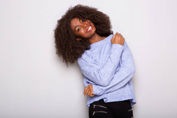 istock happy african american woman looking at camera on white background 992758024