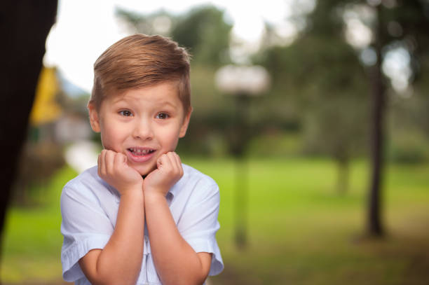 istock Cheerful cute little brown-eyed boy 992759604