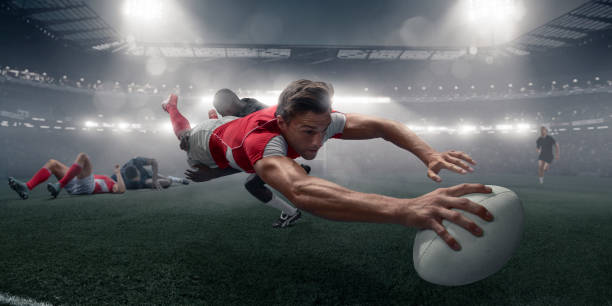 istock Rugby Player In Mid Air Dive With Ball To Score 992762714